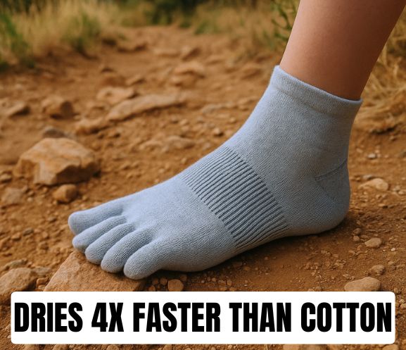 Foot in a light grey toe sock on a dirt path